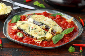 Grilled aubergine, eggplant topped with parmesan cheese crust on crashed tomatoes. Vegetarian pizza version