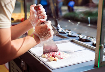 stir-fried ice cream rolls at freeze pan. Organic, natural rolled ice cream, hand made dessert.