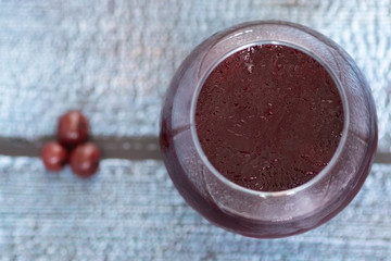 Juicy chilled drink in a large glass is ready to fight and win the thirst.