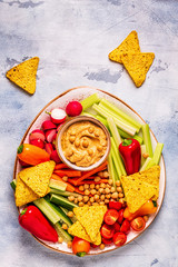 Hummus with various fresh raw vegetables.