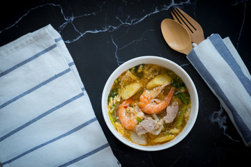 Seafood and pork sukiyaki in white bowl