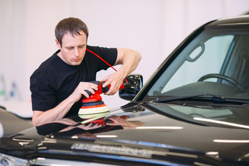 Polishing the car body.