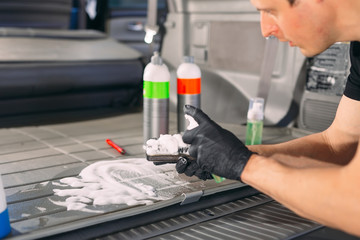 Car chemist. Chemical treatment of the car trunk.