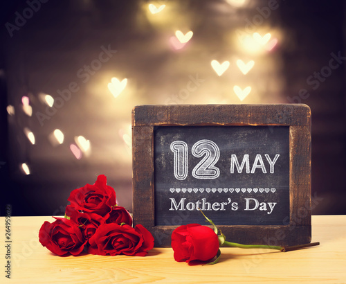 12 May Mothers day message on a small chalkboard with red roses