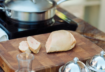 Goose liver on a wooden Board in the restaurant before cooking.