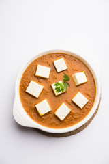 Paneer butter masala or Panir makhanwala, served in a bowl. selective focus
