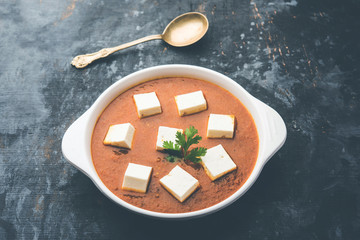 Paneer butter masala or Panir makhanwala, served in a bowl. selective focus