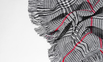 Trendy autumn scarf on a white background with space for text.