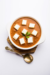 Paneer butter masala or Panir makhanwala, served in a bowl. selective focus