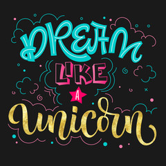 Naklejka premium Dream like a Unicorn hand drawn colorful blue pink isolated lettering on dark background.
