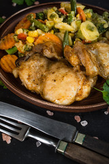 Fried chicken fillet with vegetables.