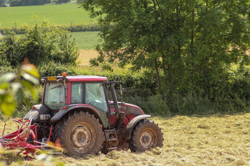 old red tractor in field