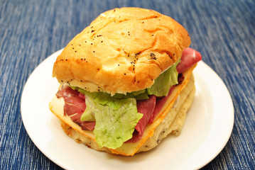 Roast Beef & Munster Cheese Deli Sandwich on a White Plate 