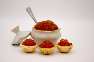 Luxury Red Caviar in the bowl. Food photo concept.