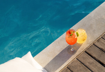 poolside symmetric cocktails served cold at pool bar with signature drink