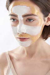 Portrait of young pretty woman with face mask