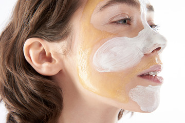 Side view of pretty woman with face mask