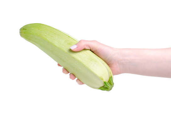 Zucchini in hand on white background isolation
