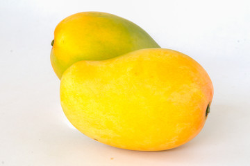 Ripe mango on a white background