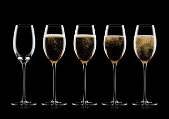 Elegant glasses of yellow champagne with bubbles
