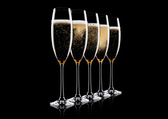 Elegant glasses of yellow champagne with bubbles