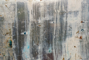 Abstract background. Window chaotically smeared with paint, illuminated by the sun.