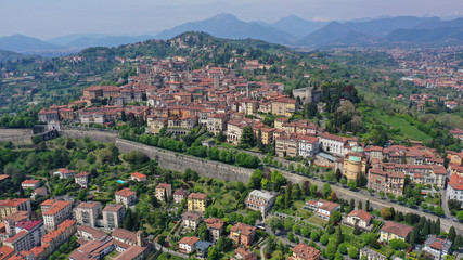 Fototapeta premium Aerial drone photo of iconic and beautiful old fortified upper Medieval city of Bergamo, Lombardy, Italy