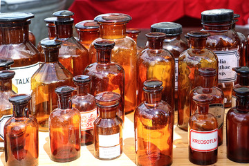 Pharmacy amber glass bottles on sell at the open air giant flea market (Riesenflohmarkt) in Munich, Germany.You find everything for every budget