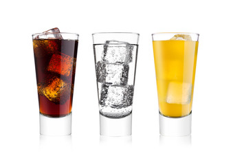 Glasses of cola and orange soda drink and lemonade