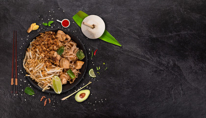 Pad thay asian food background with various ingredients on rustic stone background , top view.
