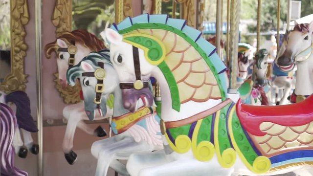 Horses on the carousel, attraction, amusement Park.