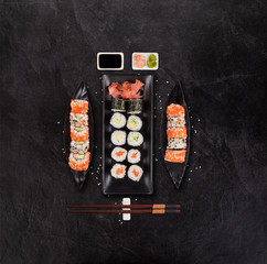Japanese sushi set on black stone background