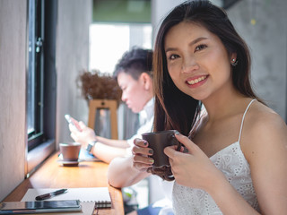 young Asia woman sitting enjoy in coffee cafe