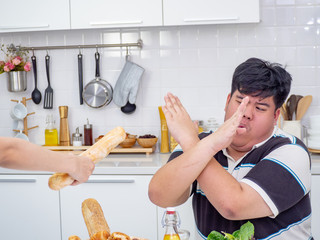 Asian fat man reject unhealthy food from another people