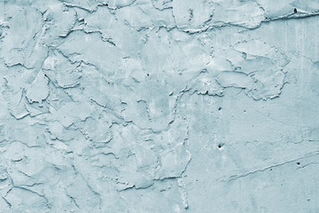 Grunge blue painted rough textured wall