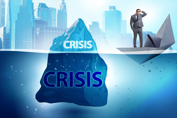 Crisis concept with businessman on iceberg
