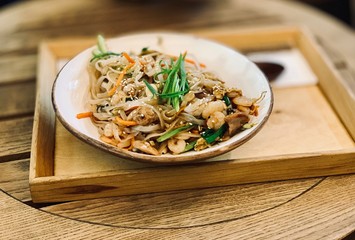 Noodles with shrimp and vegetables. Asian dish.
