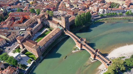 Aerial drone photo from iconic fortified medieval castle and bridge of Castelvecchio used as a museum, Verona, Italy