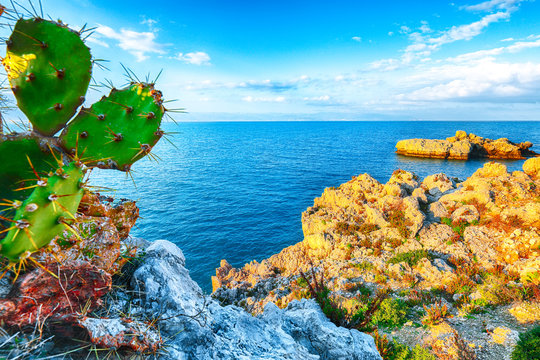 Dramatic spring sunset on the the cape Milazzo panorama of nature reserve Piscina di Venere.