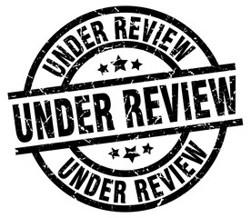 under review round grunge black stamp