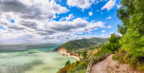 Picturesque islets Faraglioni di Puglia in summer Adriatic sea bay Baia Delle Zagare