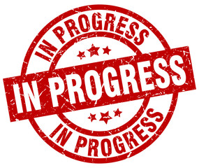 in progress round red grunge stamp