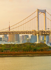 View of the Tokyo Bay and Rainbow Bridge at sunset in Tokyo.