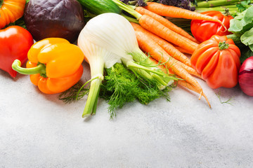 Fresh raw vegetables on off white background, copy space, selective focus