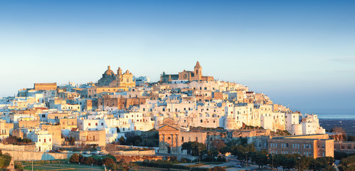 Fototapeta premium Ostuni white town skyline at sunrise