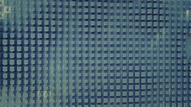 Wall of metallic blocks. Abstract futuristic industry concept. Seamless loop 3D render animation 4k UHD 3840x2160