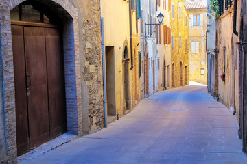 Obraz na płótnie Canvas Narrow street in historic center of Montalcino town, Val d'Orcia, Tuscany, Italy