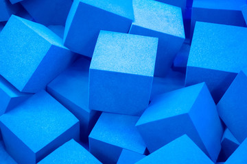 Blue cubes. Geometric figures. Background with cubes. Graphic background in blue.
