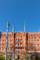 Historic post office building in nordic style in Brick Gothic at blue sky, Poland, Szczecin