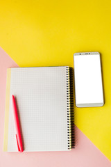 Creative flat lay photo of workspace desk with smartphone,and notebook with copy space background, minimal style